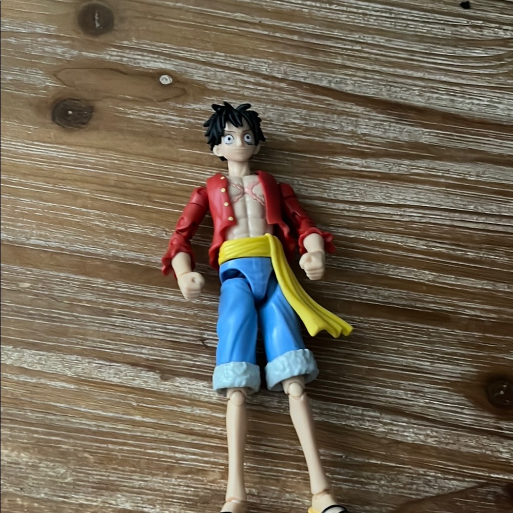 Action Figure with Red Jacket and Blue Shorts